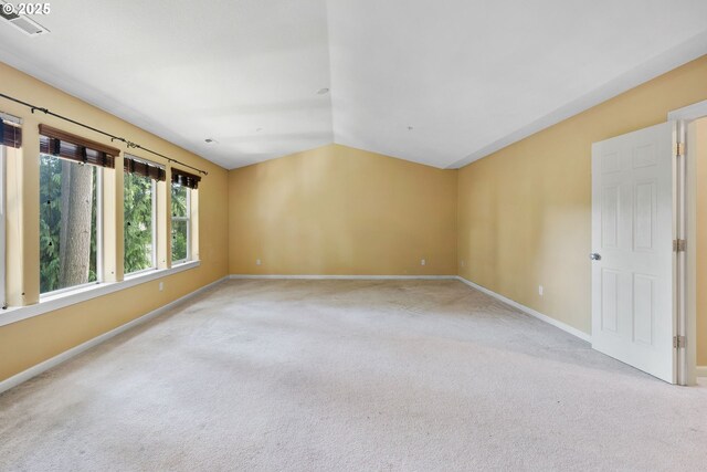 15111 Oyer Dr, Oregon City, OR 97045 - empty room with light colored carpet, baseboards, and vaulted ceiling