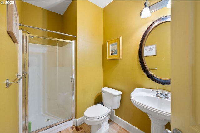 15111 Oyer Dr, Oregon City, OR 97045 - full bath with a stall shower, toilet, wood finished floors, and baseboards