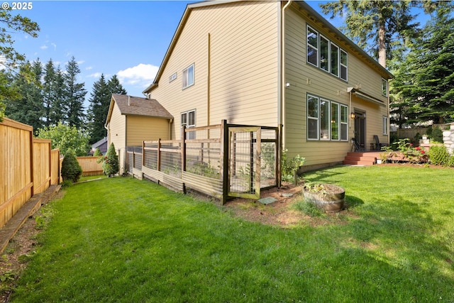 15111 Oyer Dr, Oregon City, OR 97045 - back of property with a vegetable garden and a fire pit