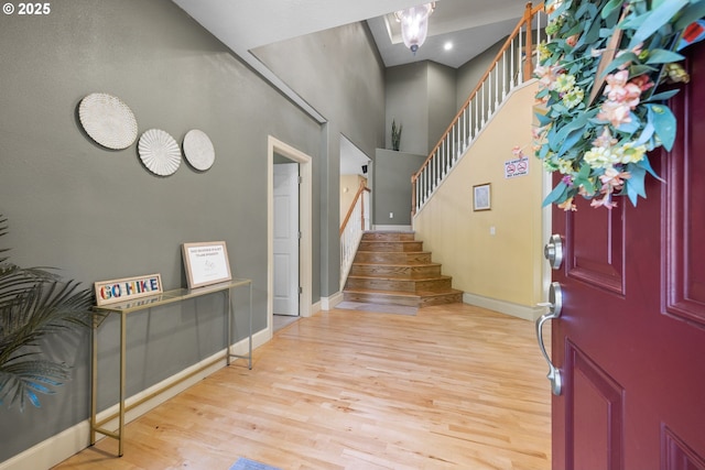 15111 Oyer Dr, Oregon City, OR 97045 - entryway with wood finished floors, stairway, baseboards, and a towering ceiling