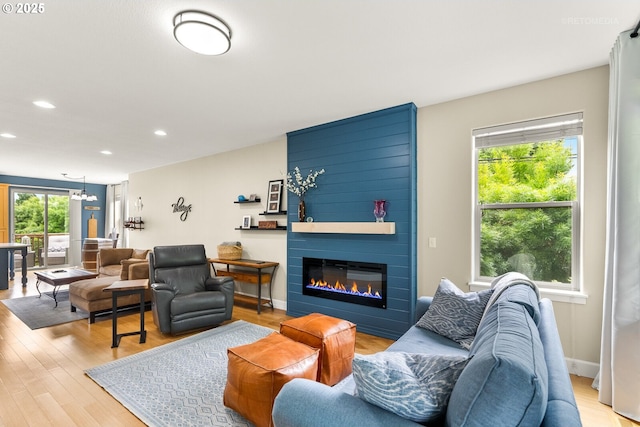 1902 NE 48th Way, Hillsboro, OR 97124 - living area featuring a fireplace, light wood-type flooring, recessed lighting, and a chandelier
