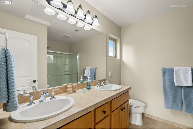 1902 NE 48th Way, Hillsboro, OR 97124 - full bathroom with a shower stall, tile patterned floors, toilet, and double vanity