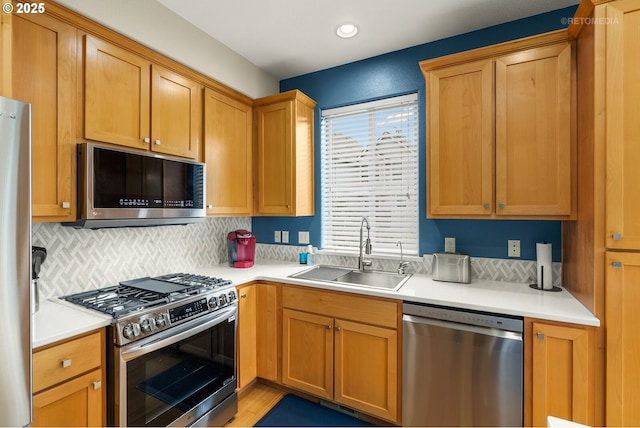 1902 NE 48th Way, Hillsboro, OR 97124 - kitchen with appliances with stainless steel finishes, a sink, light countertops, decorative backsplash, and recessed lighting