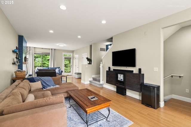 1902 NE 48th Way, Hillsboro, OR 97124 - living room featuring light wood-style flooring, baseboards, recessed lighting, and stairway