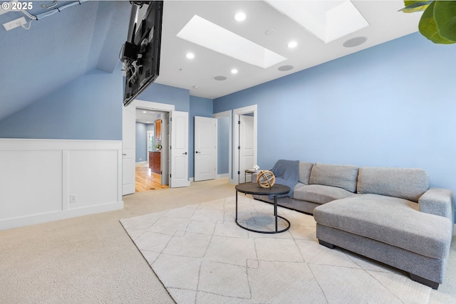 3646 SW Baird St Unit 3, Portland, OR 97219 - living area with a skylight, light carpet, wainscoting, and recessed lighting