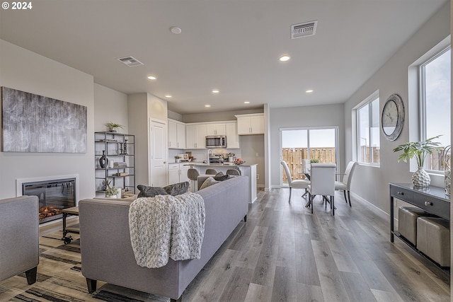 3619 Chestnut St Lot 51, Forest Grove, OR 97116 - living room with recessed lighting, baseboards, light wood finished floors, and a glass covered fireplace
