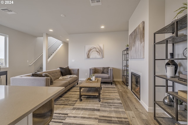 3619 Chestnut St Lot 51, Forest Grove, OR 97116 - living room with light wood finished floors, recessed lighting, a glass covered fireplace, stairway, and baseboards