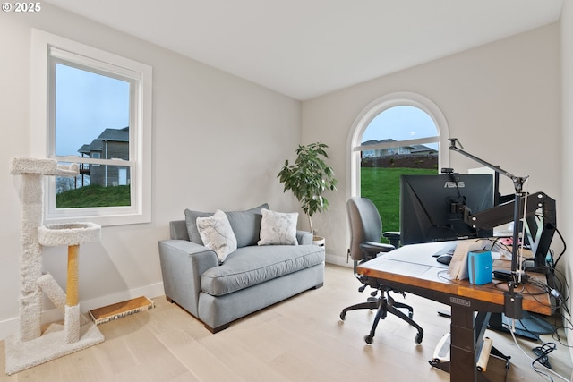 office area with wood finished floors and baseboards