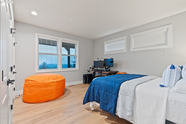 bedroom featuring recessed lighting, baseboards, and wood finished floors