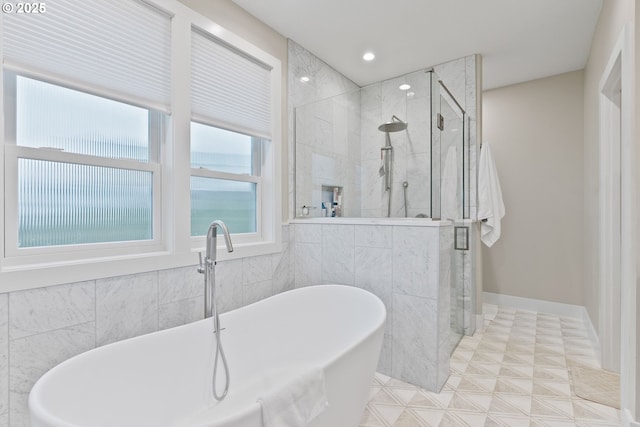 full bathroom with a soaking tub, recessed lighting, and a stall shower