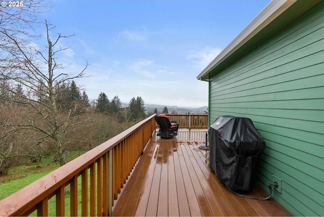 wooden deck featuring grilling area