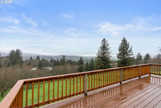 deck featuring a lawn