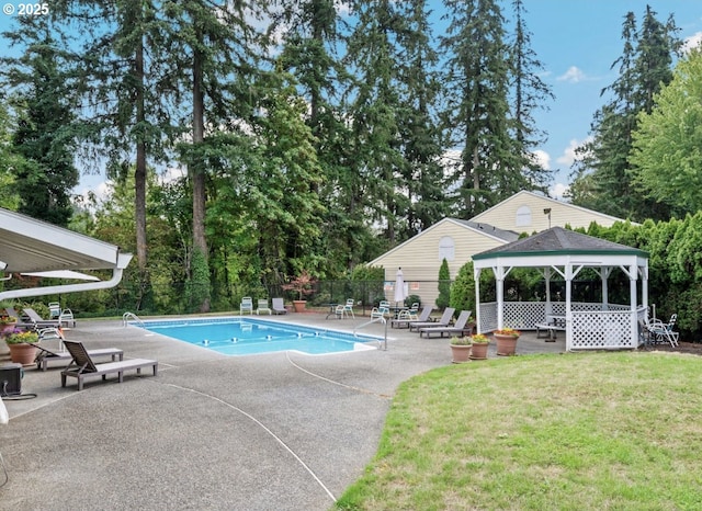 view of pool with a gazebo, a yard, and a patio area