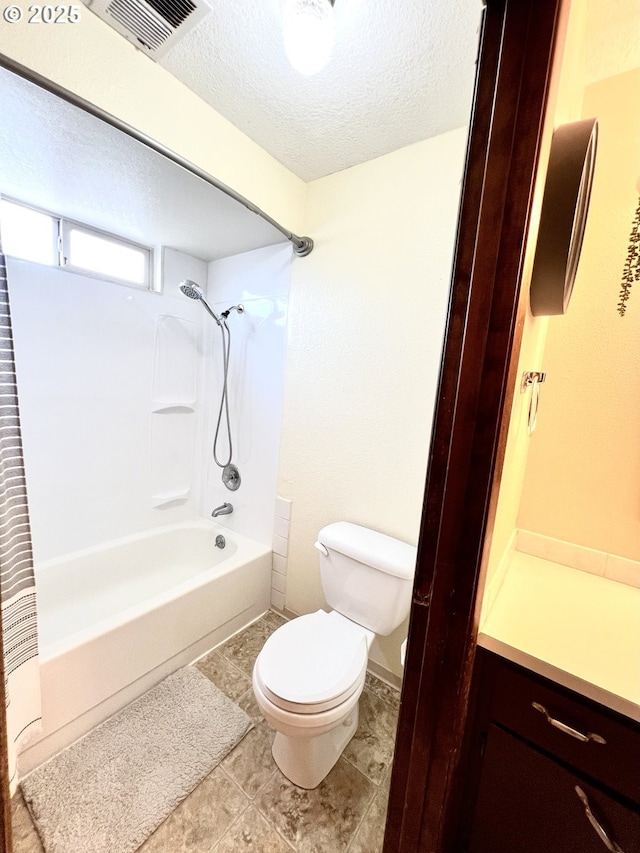 full bath featuring visible vents, toilet, bathing tub / shower combination, and a textured ceiling