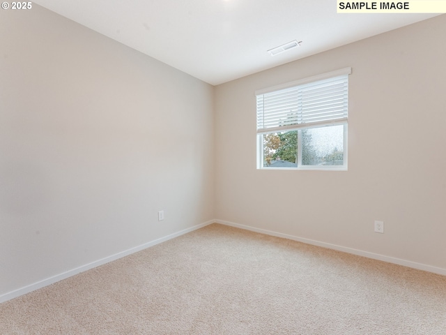 unfurnished room featuring carpet floors