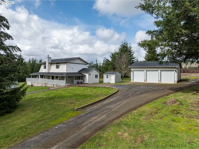 20256 S Swank Rd, Colton, OR 97017 - farmhouse inspired home featuring a storage shed, a garage, a chimney, an outdoor structure, and a front yard
