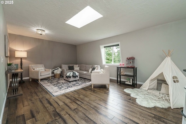20256 S Swank Rd, Colton, OR 97017 - living room with a textured ceiling, baseboards, wood finished floors, and a skylight