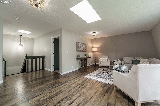 20256 S Swank Rd, Colton, OR 97017 - living room with a skylight, a textured ceiling, and dark wood-type flooring