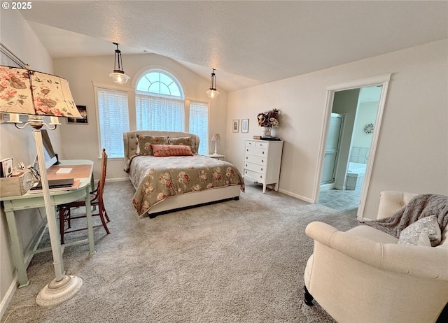 carpeted bedroom featuring a textured ceiling, baseboards, vaulted ceiling, and connected bathroom