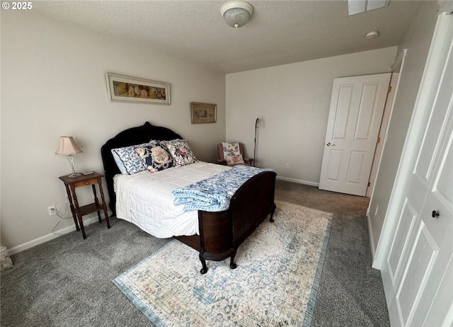 bedroom featuring a textured ceiling, dark carpet, visible vents, and baseboards