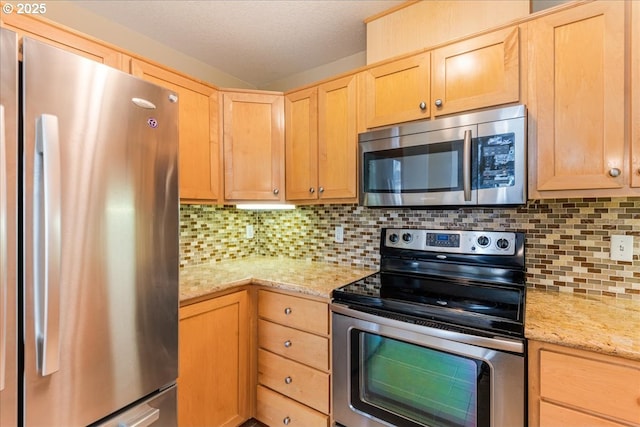 1819 NE 101st Ave Unit 201, Hillsboro, OR 97006 - kitchen with stainless steel appliances, light brown cabinetry, decorative backsplash, and light stone counters