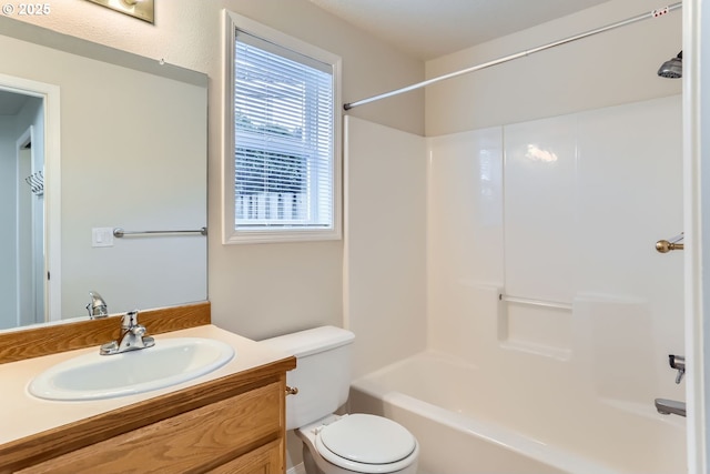 full bathroom with vanity, bathtub / shower combination, and toilet