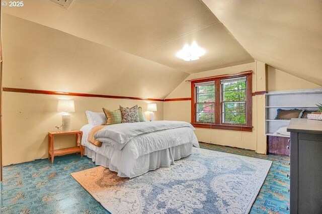 bedroom featuring lofted ceiling