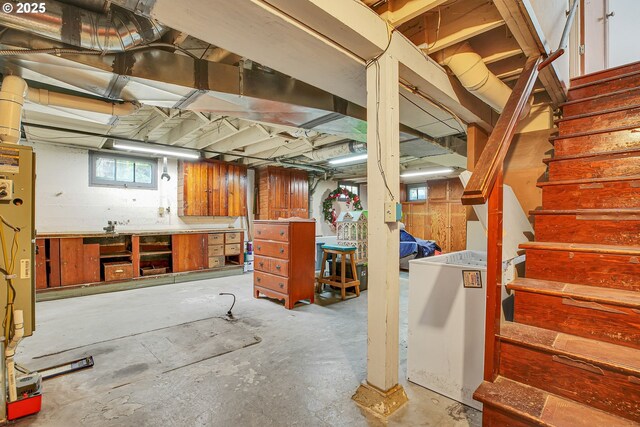 below grade area with stairway and a workshop area