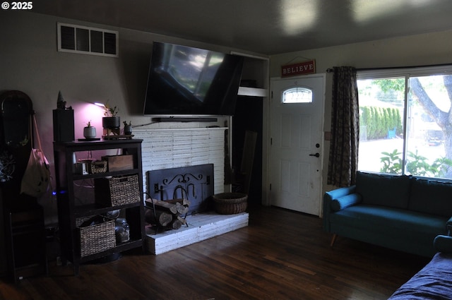 1529 Brentwood Ave, Eugene, OR 97404 - living area with wood finished floors and a brick fireplace