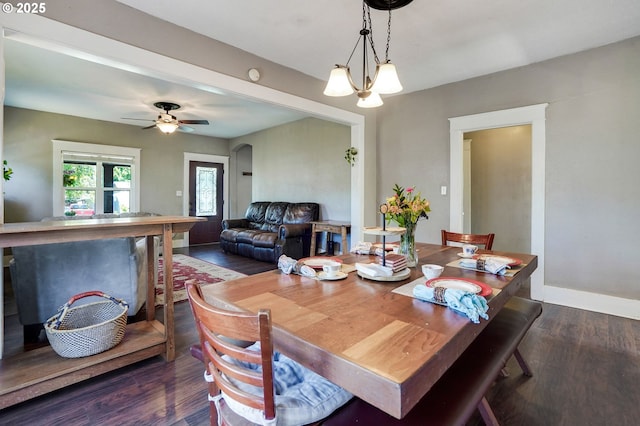 318 Koons St, Silverton, OR 97381 - dining space with dark wood-style floors, baseboards, a chandelier, and ceiling fan