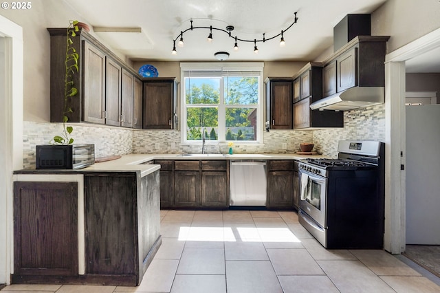 318 Koons St, Silverton, OR 97381 - kitchen with appliances with stainless steel finishes, a sink, and dark brown cabinets