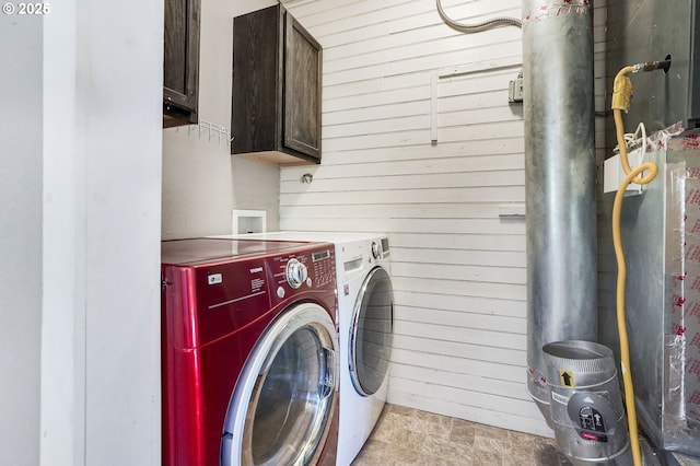318 Koons St, Silverton, OR 97381 - laundry area with separate washer and dryer, wood walls, and cabinet space