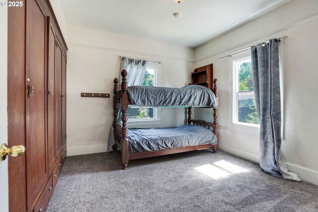 318 Koons St, Silverton, OR 97381 - carpeted bedroom with multiple windows and baseboards