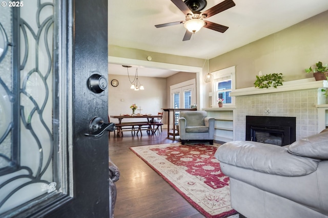 318 Koons St, Silverton, OR 97381 - living room with a tile fireplace, dark wood finished floors, and ceiling fan