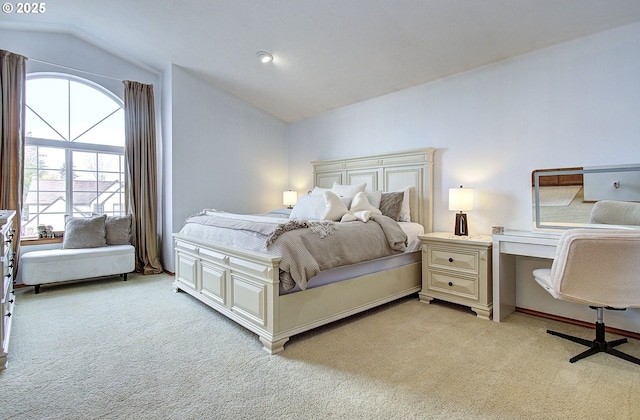 bedroom with light carpet and vaulted ceiling
