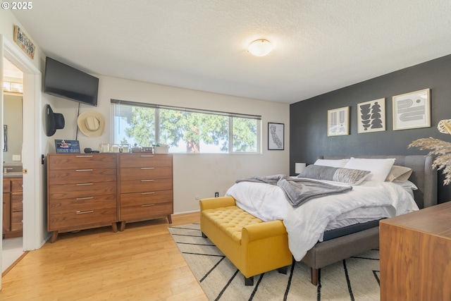 bedroom featuring light wood-style flooring