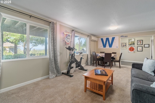 living room with a healthy amount of sunlight, a wall mounted air conditioner, a textured ceiling, and light colored carpet