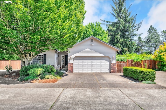 1041 Irving Rd, Eugene, OR 97404 - view of front facade with brick siding, concrete driveway, and a garage