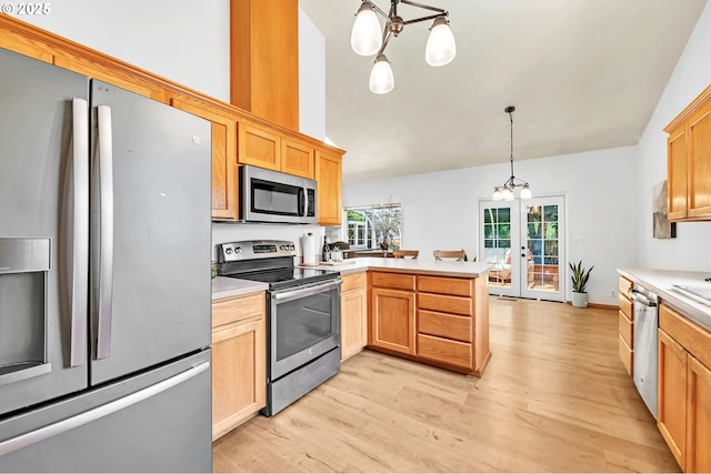 1041 Irving Rd, Eugene, OR 97404 - kitchen featuring stainless steel appliances, french doors, a peninsula, light countertops, and vaulted ceiling