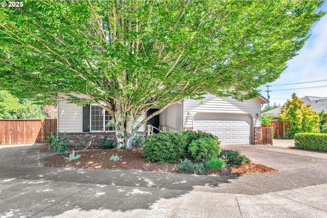 1041 Irving Rd, Eugene, OR 97404 - view of property hidden behind natural elements with brick siding and concrete driveway