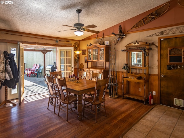 10160 NW Gordon Rd, Cornelius, OR 97113 - dining space with a textured ceiling, wood walls, ceiling fan, wood finished floors, and a wainscoted wall