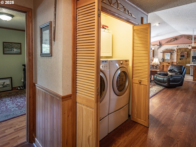 10160 NW Gordon Rd, Cornelius, OR 97113 - laundry area with a textured ceiling, cabinet space, dark wood-style flooring, a wainscoted wall, and wooden walls