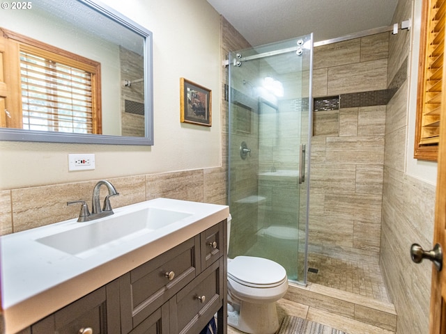 10160 NW Gordon Rd, Cornelius, OR 97113 - full bathroom with vanity, a stall shower, and tile walls