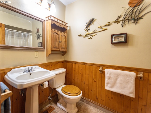 10160 NW Gordon Rd, Cornelius, OR 97113 - bathroom with a wainscoted wall, wooden walls, and a shower with curtain