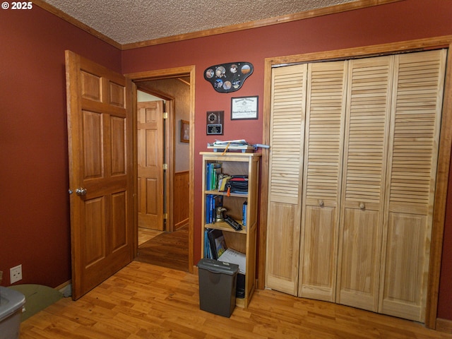 10160 NW Gordon Rd, Cornelius, OR 97113 - corridor with light wood-style flooring, ornamental molding, and a textured ceiling