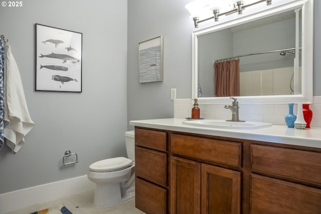 full bathroom featuring toilet, decorative backsplash, vanity, baseboards, and tile patterned floors