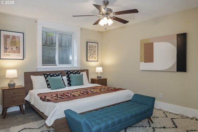 bedroom featuring ceiling fan, carpet floors, and baseboards