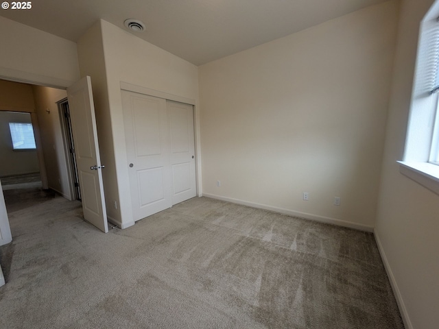 3159 SW Jaden Dr, Beaverton, OR 97003 - unfurnished bedroom featuring carpet floors, multiple windows, and a closet