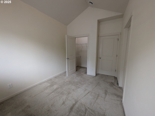 3159 SW Jaden Dr, Beaverton, OR 97003 - unfurnished bedroom featuring light carpet, lofted ceiling, baseboards, and a closet