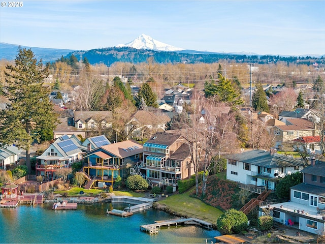 bird's eye view with a water and mountain view and a residential view